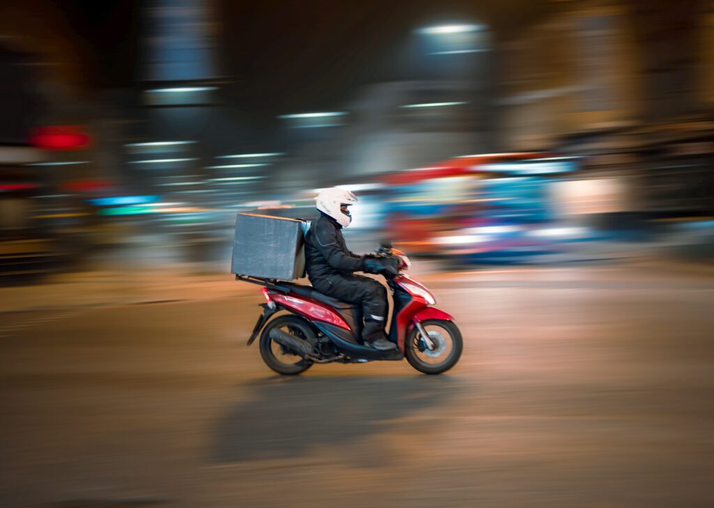 Delivery person on motorcycle