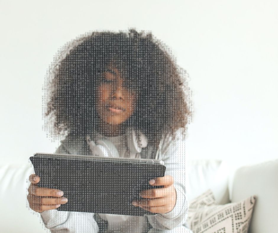 An Afro-Haired Woman Using a Tablet